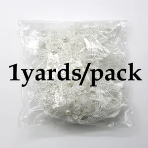 White lace trim detail with pearl accents packaged in clear bag for sewing and craft DIY.