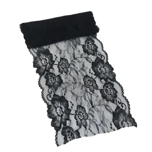 Detailed close-up of black elastic lace trim, showing intricate floral patterns for DIY.