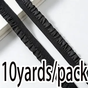 Detailed view of black ruffled elastic trim, 1cm wide stretch ribbon for sewing and DIY crafts.
