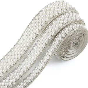 Close-up detail of self-adhesive pearl rhinestone trim ribbon for DIY craft and sewing decoration