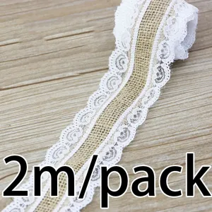 Burlap ribbon lace trim detail shot, rustic jute fabric with white lace for DIY craft sewing.