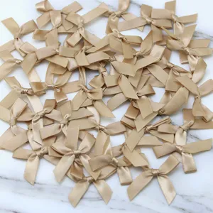 Gold satin ribbon bows bulk set for DIY crafts, apparel sewing and party decoration.