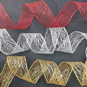 Close up view of hollow metallic glitter ribbon, mesh design for gift wrapping and festival decor.