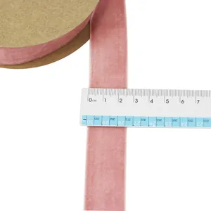Pink velvet ribbon detail view, 2.5cm width flocked fabric strap for DIY crafts and gift bows.