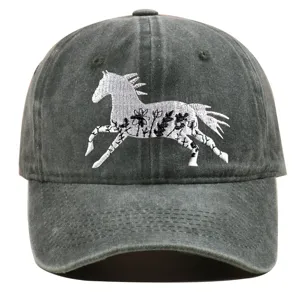 Detail of washed cotton baseball cap with intricate horse landscape embroidery