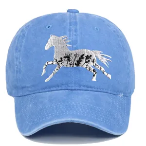 Close-up of floral horse embroidery on blue washed cotton baseball cap for outdoor leisure.