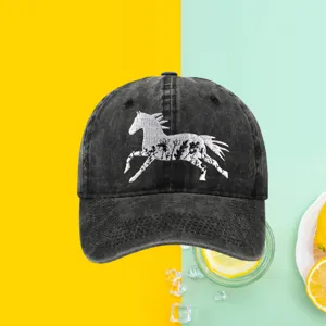 Close-up of white running horse floral embroidery on a black washed cotton baseball cap