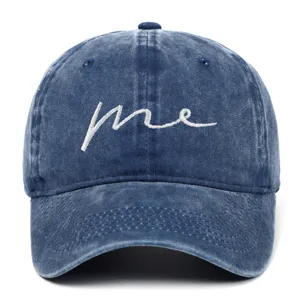 Front view of minimalist washed denim baseball cap with white me embroidery detail