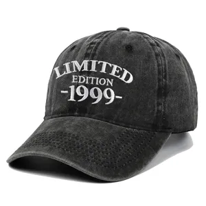 Macro detail shot of a black washed vintage baseball cap with white 1999 embroidery