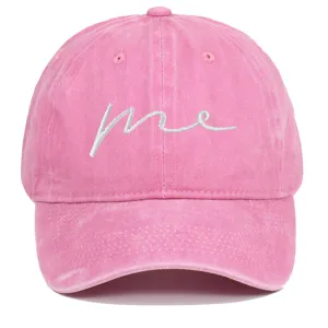 Detail of pink washed cotton baseball cap with white me embroidery