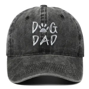 Vintage washed black cotton baseball cap with white DOG DAD embroidery and paw print.