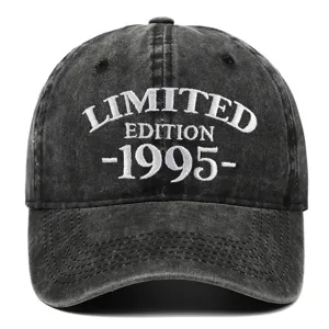 Macro detail of a washed black denim baseball cap with 1995 Limited Edition embroidery