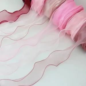 Sheer organza ribbon rolls detail view, wavy edge flower wrapping and gift packaging craft.