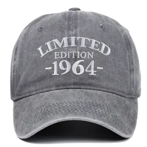 Detailed view of white 1964 embroidery on a distressed grey washed cotton baseball cap