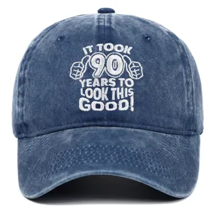 Detailed view of white embroidery on washed navy cotton 90th birthday baseball cap