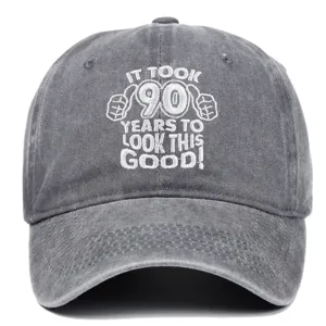Detail of the embroidered 90th birthday message on a gray washed cotton baseball cap.