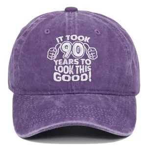 Washed purple baseball cap with 90th birthday embroidery: 'It took 90 years to look this good'