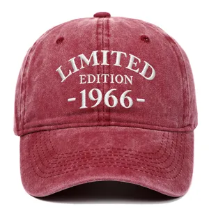 Close-up of 'LIMITED EDITION 1966' white embroidery on a red washed cotton baseball cap