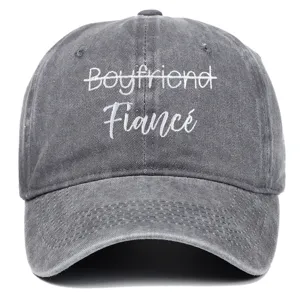 Close-up of 'Boyfriend Fiancé' embroidery on grey washed vintage baseball cap
