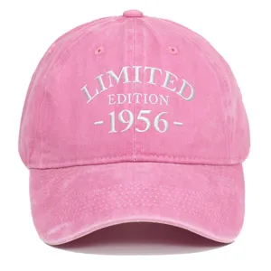 Macro detail of pink washed baseball cap featuring white 1956 Limited Edition embroidery