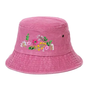 Detailed close-up of a pink washed vintage bucket hat featuring vibrant floral embroidery