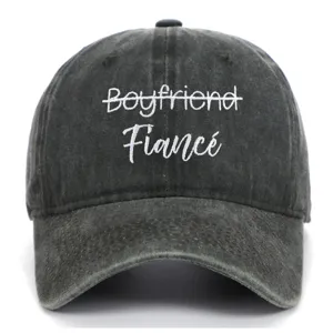 Detailed view of white Fiancé embroidery on vintage washed gray cotton baseball cap