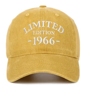 Detail of white 'Limited Edition 1966' embroidery on a washed yellow cotton baseball cap