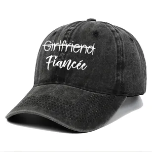 Close-up detail of vintage washed baseball cap featuring white 'Fiancée' embroidery