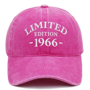 Detail view of white embroidery 'LIMITED EDITION 1966' on pink washed cotton baseball cap