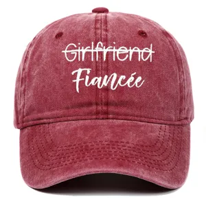 Detailed shot of washed cotton baseball cap with white Fiancée embroidery