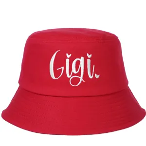 Detailed view of a vibrant red cotton bucket hat with white Gigi embroidery design