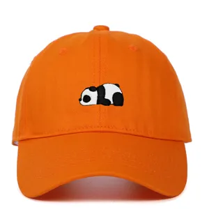Detailed view of cute embroidered panda on a vibrant orange soft top cotton baseball cap