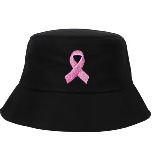 Detailed view of pink ribbon breast cancer awareness embroidery on black bucket hat