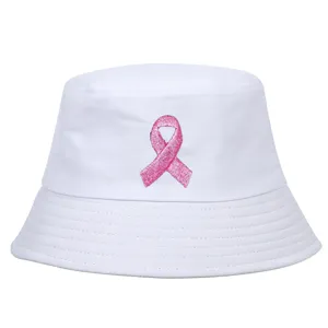 Close-up of white bucket hat with pink ribbon breast cancer awareness embroidery