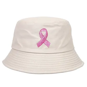 Close-up detail of beige bucket hat featuring a pink ribbon embroidery for awareness.