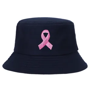 Detailed front view of navy blue bucket hat featuring pink ribbon breast cancer awareness embroidery