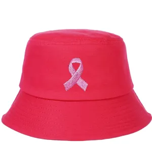 Detailed view of a bright pink bucket hat featuring a pink ribbon embroidery for breast cancer awareness