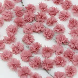 Close-up detail of pink chiffon flower lace trim, perfect for sewing, crafts, and DIY dress decor.