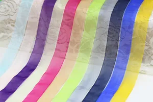 Colorful organza ribbon detail showing sheer fabric texture for gift box and flower wrapping.