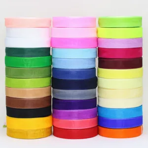 Colorful organza ribbon rolls detail view for flower wrapping gift box and cake packaging.