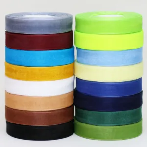 Colorful organza ribbon rolls for gift wrapping, bouquet decoration and baking DIY crafts.