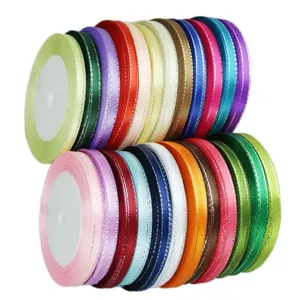 Detailed close-up of colorful narrow satin ribbons with silver edges for gift wrapping.