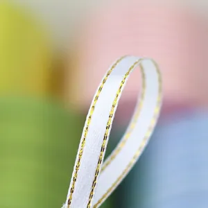 White gold edged ribbon 6mm detail shot for gift wrapping bow crafting sewing decor