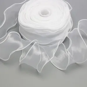 Detail view of white organza ribbon with wired edge, perfect for floral wrapping and gifts.