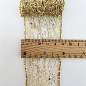 Gold glitter ribbon detail view, shimmering hollow lace craft trim with measuring ruler display.
