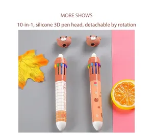 Gros plan d'un joli stylo à bille rétractable 10 couleurs avec tête d'ours en silicone