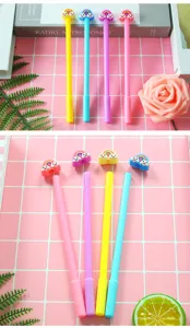 Detail view of colorful cartoon rainbow cloud toppers on cute pastel gel pens