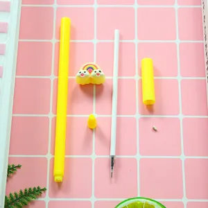 Cute yellow rainbow cloud gel pen stationery set shown disassembled on pink grid background