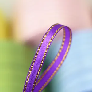 Purple ribbon with gold edge detail shot, perfect for gift box packaging and making bows.