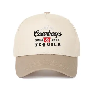 Detailed view of Cowboys and Tequila embroidery on a two-tone five-panel trucker cap